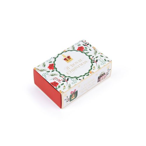 matchbox packaging of three chocolate wreaths including illustrations of flowers and foliage and presents on the outside including gold foil stars