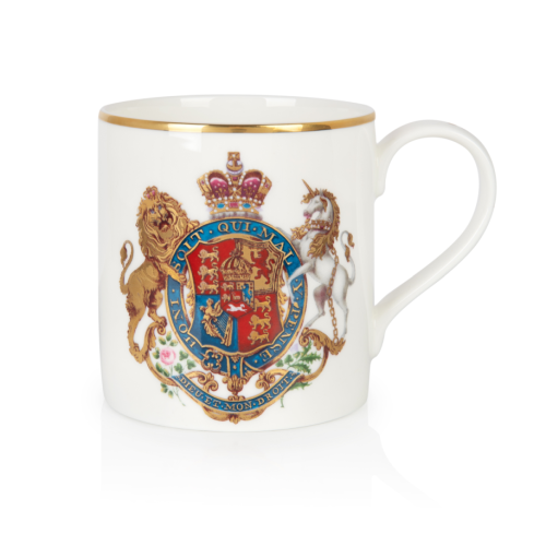 a white mug with royal crest, and handle