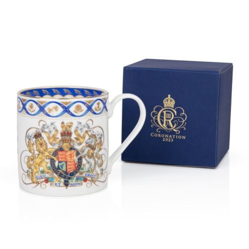 White coffee mug with Royal coat of arms, blue ribbon and national flowers in gold round the rim.