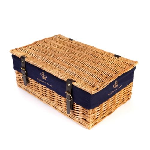Wicker hamper with blue lining and printed with a gold crown and the words 'Buckingham Palace'