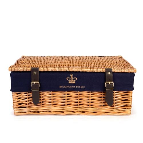 Wicker hamper with blue lining and printed with a gold crown and the words 'Buckingham Palace'