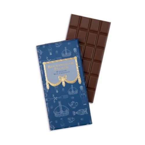 Blue packaging with white illustrations next to chocolate bar.