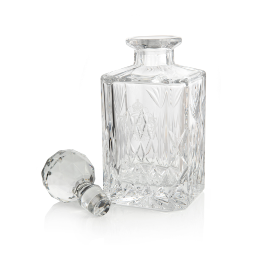 Decanter photographed with ornate background. 