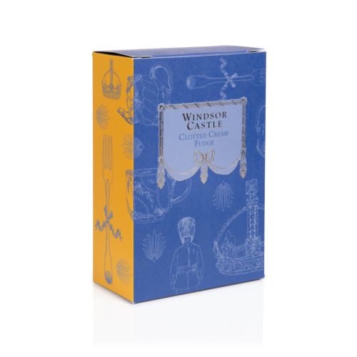 Front and side of Windsor Castle clotted cream fudge. Blue box with yellow coloured side. White illustrations of a variety of items including a crown, teapot and guardsman.