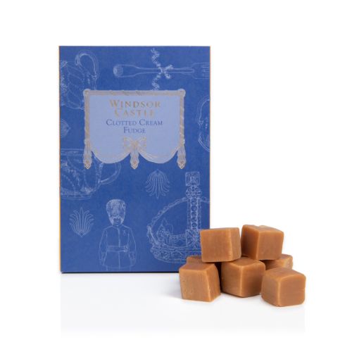 Front and side of Windsor Castle clotted cream fudge. Blue box with yellow coloured side. White illustrations of a variety of items including a crown, teapot and guardsman.