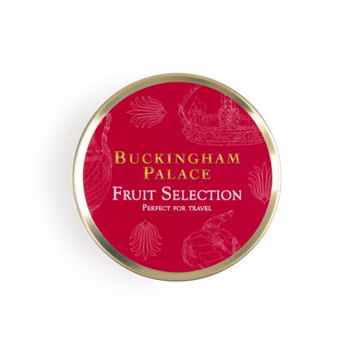 Top of tin of fruit selection. Red background on gold round tin with white illustrations featuring a variety of illustrations including teacup, fork and crown. 