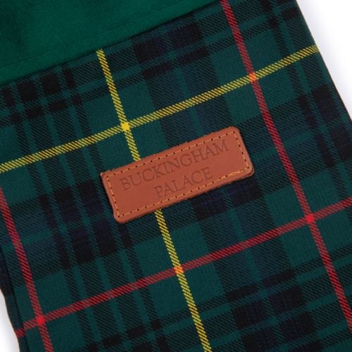 Green tartan stocking with brown leather label with BUCKINGHAM PALACE ebossed on the front.