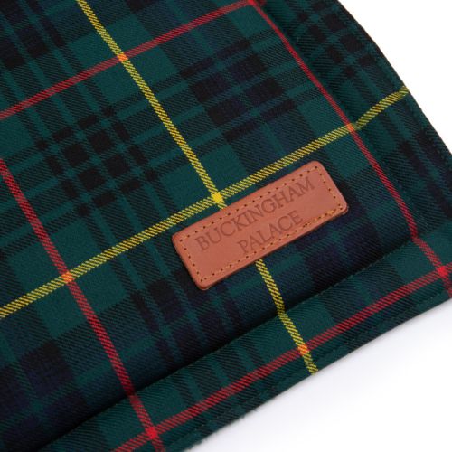 Pet mat in a green tartan fabric and a small rectangle detailing in the right bottom corner which reads BUCKINGHAM PALACE.