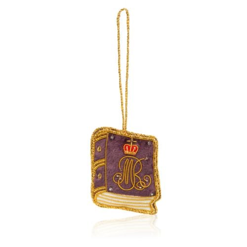 Purple book decoration with gold thread finish and string. 