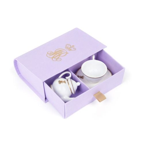 Miniature teapot and teacup and saucer presented in lilac book-style box with draw and Queen Mary's cypher.