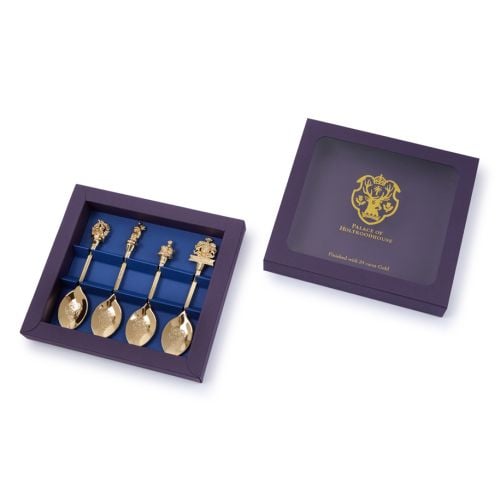 Purple outer box containing four gold plated Palace of Holyrood house decorative spoons.
