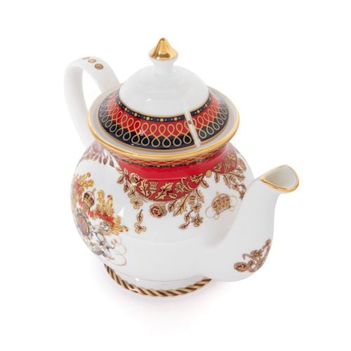 This Livey Teapot featuring the royal coat of arms and a deep, rich scarlet edge and navy border with contrasting fine gold details, inspired by the intricate decorative braiding of hand-sewn livery and regimental devices of ceremonial uniform