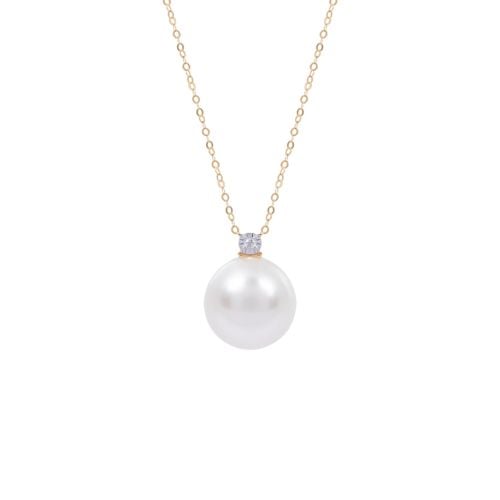 Delicate gold chain with small diamond connected to large South Sea pearl. 