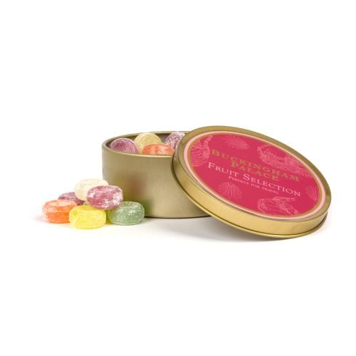 Lid of Buckingham Palace Fruit Selection. Red with white illustrations of crowns and teapots. Gold edge. 