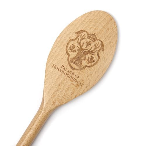 Wooden spoon with the Palace of Holyrood House emblem carved on the back. 