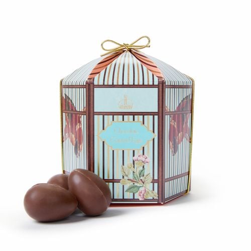 Birdcage inspired East Wing Chocolate Caramel Eggs with chocolate eggs to side. 