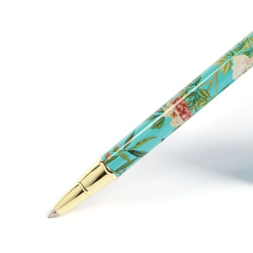 East Wing Pen with light teal wallpaper box and pen. 