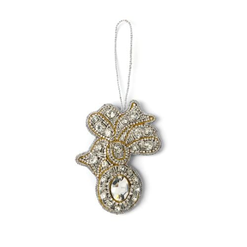 Glass crystal brooch decoration with silver string. 