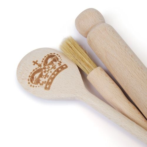 Baking set featuring a pastry brush, miniature rolling pin and wooden spoon with crown engraved on it. 