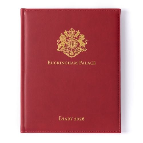 Red desk diary with gold embossed crest and lettering, Buckingham Palace Diary 2026.