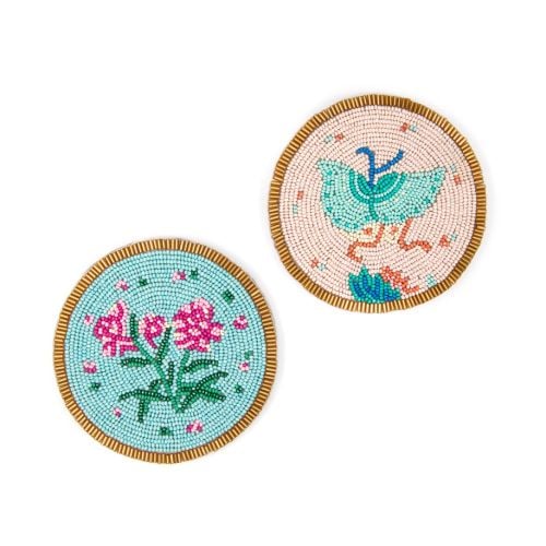 Two beaded coasters, one with a blue butterfly and one with flowers. 