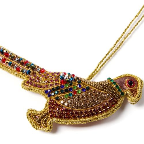 Beeded pheasant decoration with gold string. 