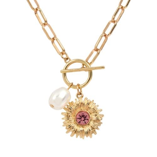 East wing sunflower necklace with yellow chain.
