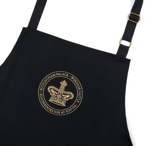 Black apron with gold emblem showing all three residences around a crown.