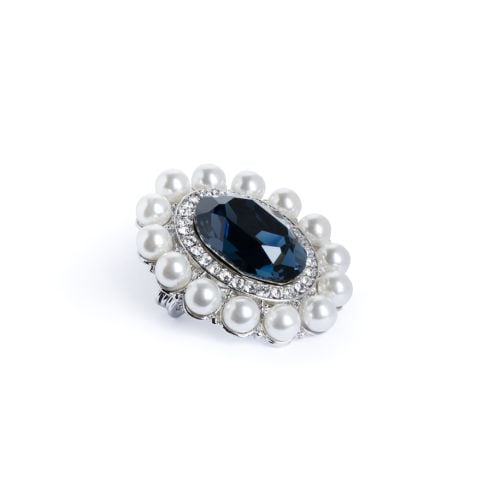 Large oval sapphire gem brooch with crystal and faux pearl border. 

