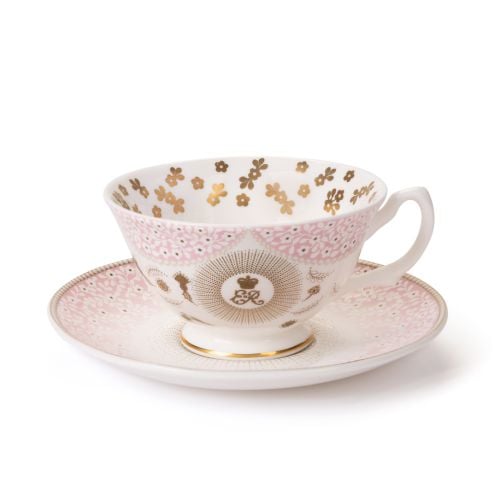 Pink foral Queen Elizabeth II teacup and saucer with central ER cypher and gold details. 