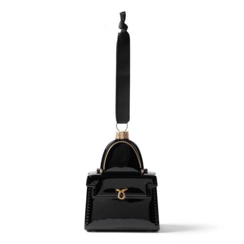 Black glass handbag decoration inspired by Queen Elizabeth II iconic Launer handbags. Hanging from black grosgrain ribbon.