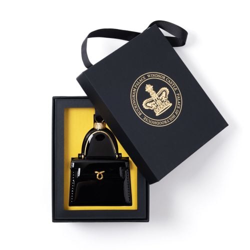 Black glass handbag decoration inspired by Queen Elizabeth II iconic Launer handbags. Hanging from black grosgrain ribbon.