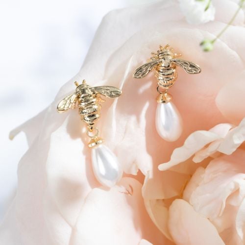 Gold bee and pearl drop earrings.