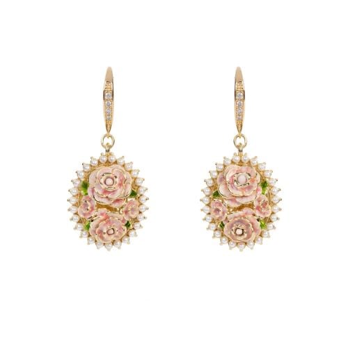 Pink rose earrings with halo of pearls.