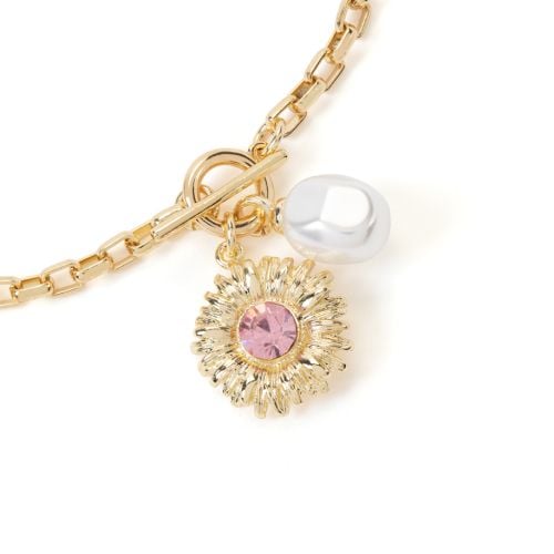 Gold plated bracelet with sunflower and pearl inspired by the East Wing in Buckingham Palace.