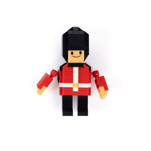 Red box containing a London Guardsman mini building blocks magnet set, featuring an illustrated block-style guardsman figure on the front.