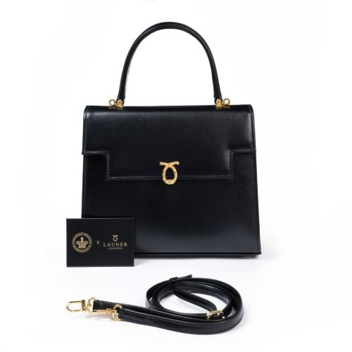 Royal Collection Trust x Launer Traviata black bag featuring straps, and mirror with collboration branding as well as gold clasps. 