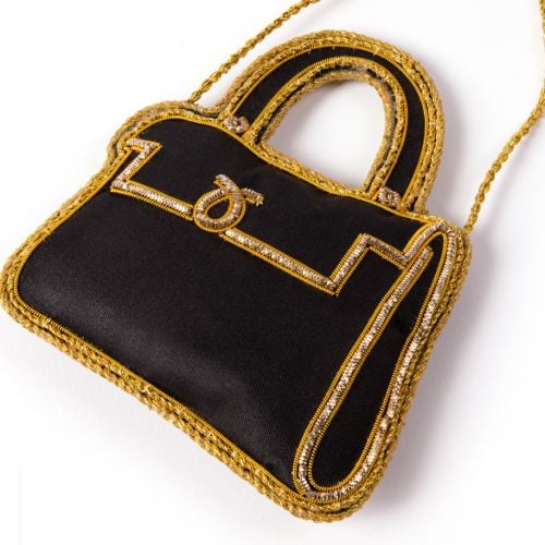 Black and gold Launer London Bag decoration. 
