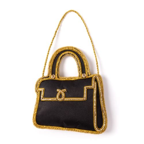 Black and gold Launer London Bag decoration. 