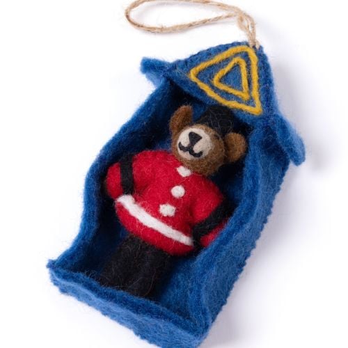 Felt sentry box ornament with miniature guardsman figure.