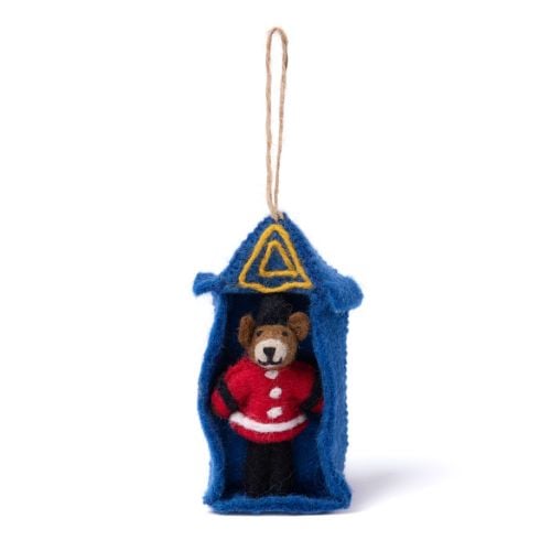 Felt sentry box ornament with miniature guardsman figure.