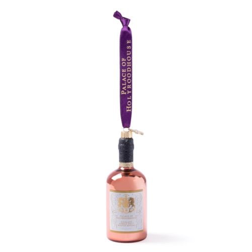 Palace of Holyroodhouse whisky bottle glass decoration with rose gold finish, hanging purple ribbon and Highland single malt Scotch whisky label.
