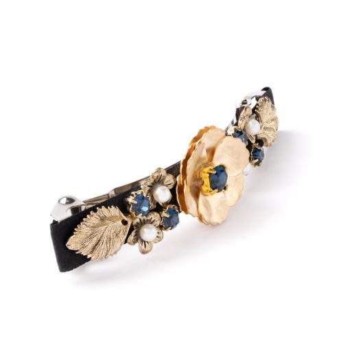 Hair clip with gold flower details and pearl and gem studs.