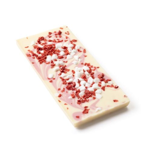 Boxed bar of “White Chocolate Eton Mess” from The Royal Pantry, Buckingham Palace. The red packaging features a crown illustration and a window showing white chocolate swirled with pink strawberry, topped with white meringue pieces and red strawberry bits
