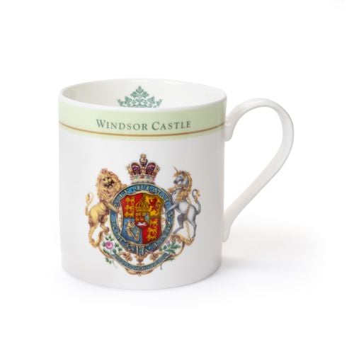 White ceramic mug with a green band and gold trim reading “Windsor Castle,” featuring a detailed Royal Coat of Arms with a lion and unicorn.

