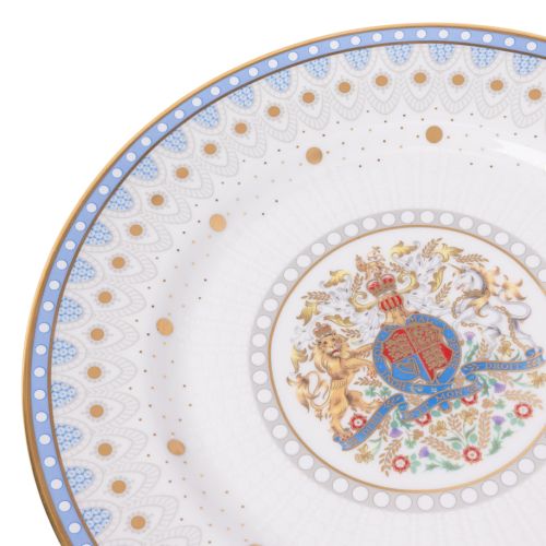 White fine bone china plate featuring a royal coat of arms at the centre, with pale blue scalloped detailing, gold dots, and 22-carat gold trim.