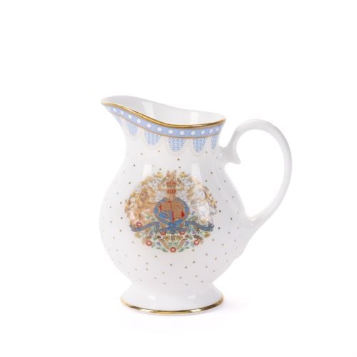 White fine bone china sugar cream jug, featuring a blue scalloped border with gold trim, gold polka dot accents, and a decorative royal-style crest on the cup, with a handle. 