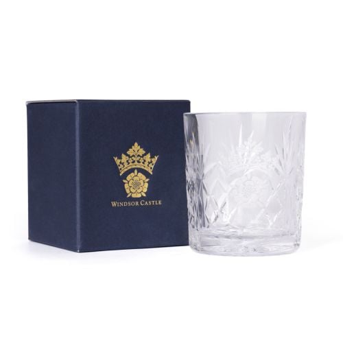 Clear cut-glass tumbler engraved with the Windsor Castle crest, shown beside a navy box with gold crest and text.