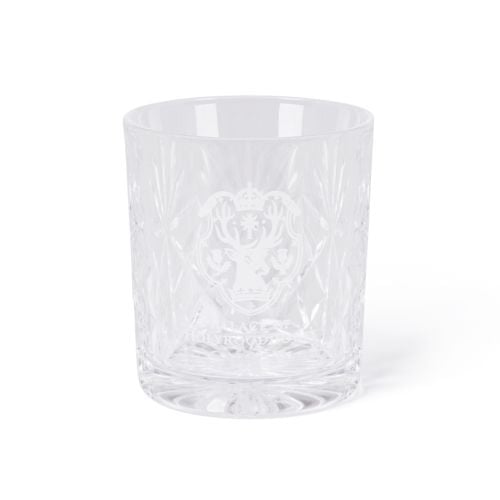 Clear cut-glass tumbler engraved with the Palace of Holyroodhouse crest, shown beside a navy box with gold crest and text.