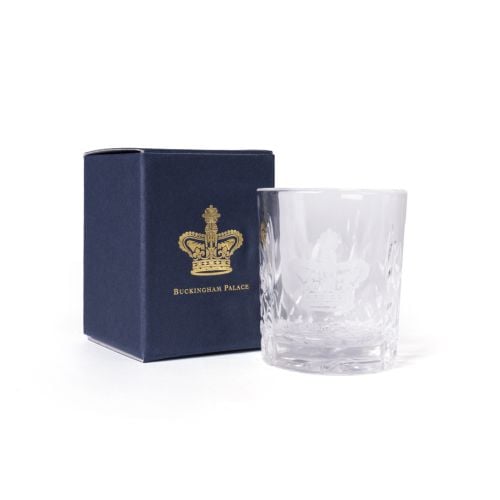 Clear cut-glass tot glass engraved with a depiction of the Imperial State Crown, shown beside a navy box with gold crest and text.